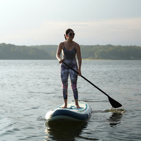 A women is paddleboarding