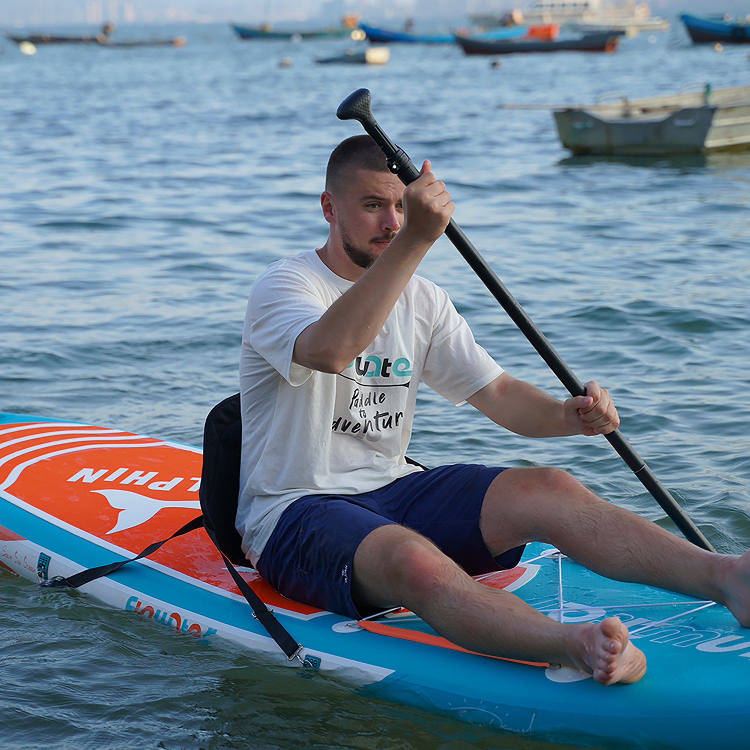 A man was wearing Funwater T-shirt and paddling on Funwater Dolphins paddle board