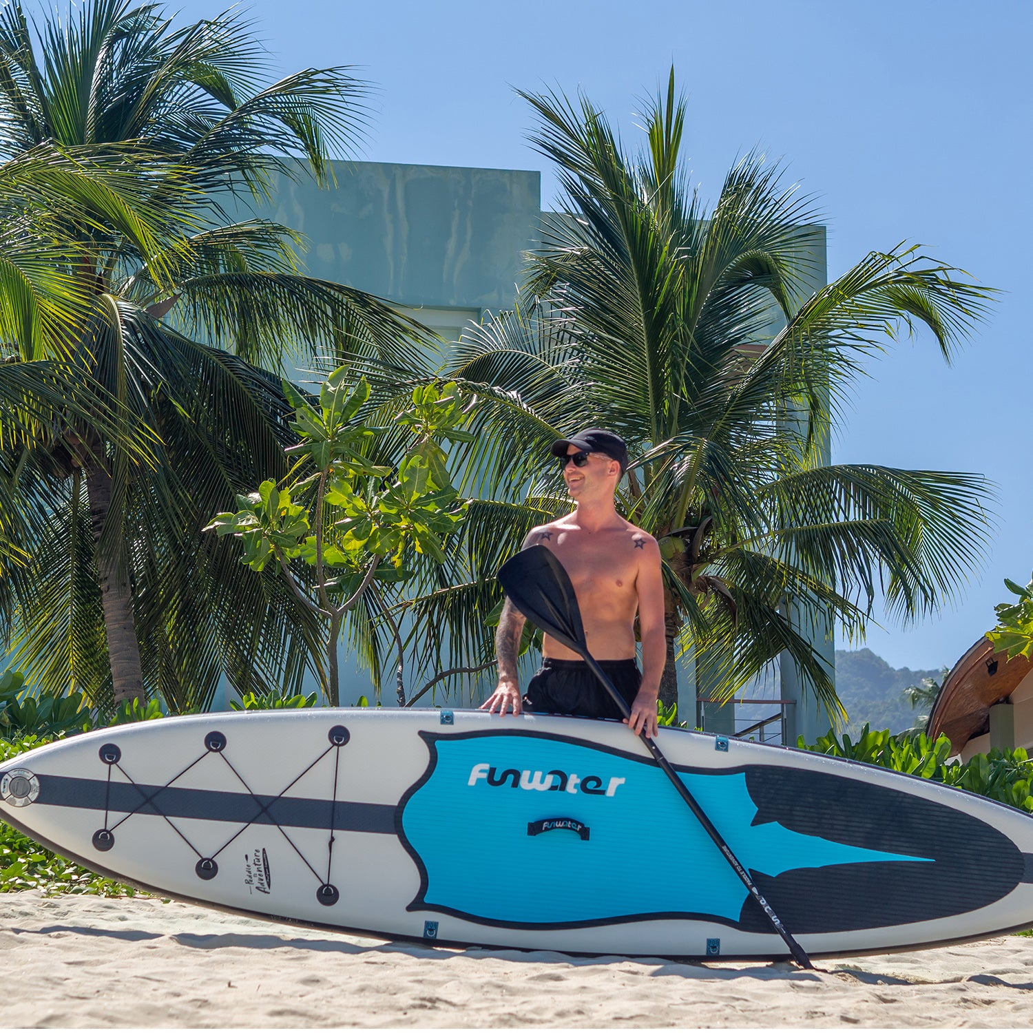 A man was standing with FUNWATER MANTA RAY 11' inflatable paddle board