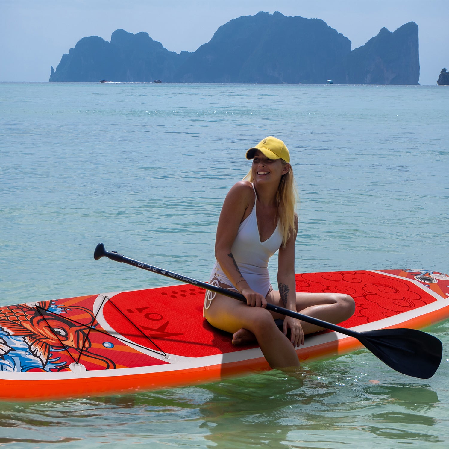 A woman was standing with Funwater inflatable SUP KOI