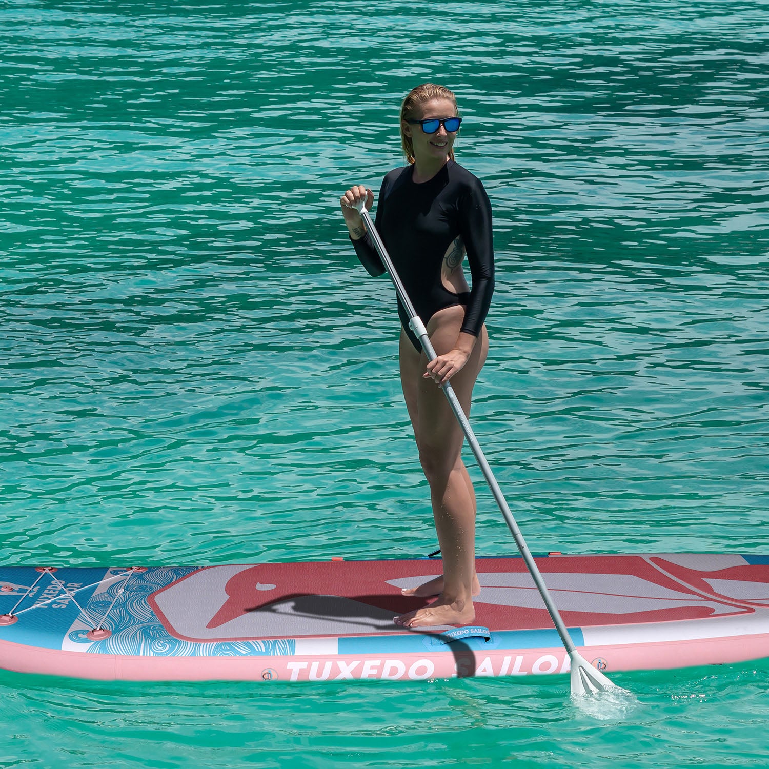 A woman was paddling with TUXEDO SAILOR SANVU 10' yoga paddle board